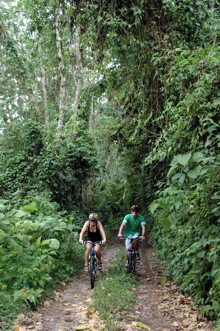 couple biking on remote road into Cabecar land