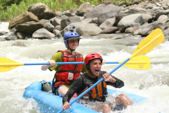 Serendipity guide with two paddlers rafting the Top Pacuare river in Costa Rica