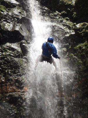 Costa Rica adventure travel: you can rappel next to tropical waterfalls into the pool at the bottom.