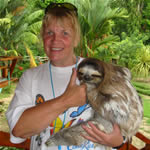 Woman holding three toed sloth