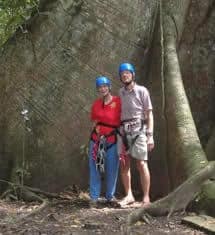 Fred and Skippy, aged 80 and 75 years, stand at the base of Abraham, just prior to ascending 110 feet to the canopy platform.