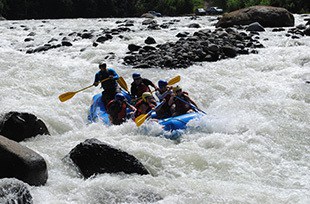 raft submerges in whitewater on private rafting trip in Costa Rica