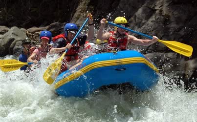 a family enjoys the whitewater on a private vacation in costa rica