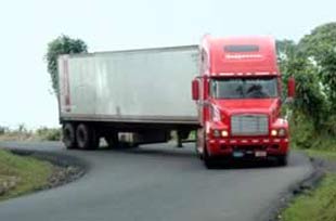 a large Truck naviagtes a curve on Costa Rica road