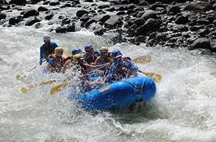 full raft hitting whitewater in costa rica on private family vacation