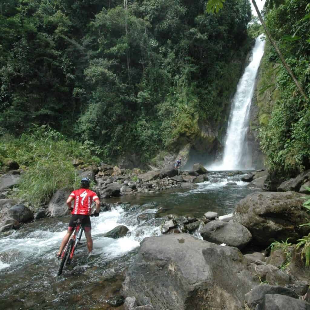 Mountain biking to a waterfall in Costa Rica