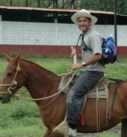a man horseback riding in Costa Rica on a teambuilding retreat