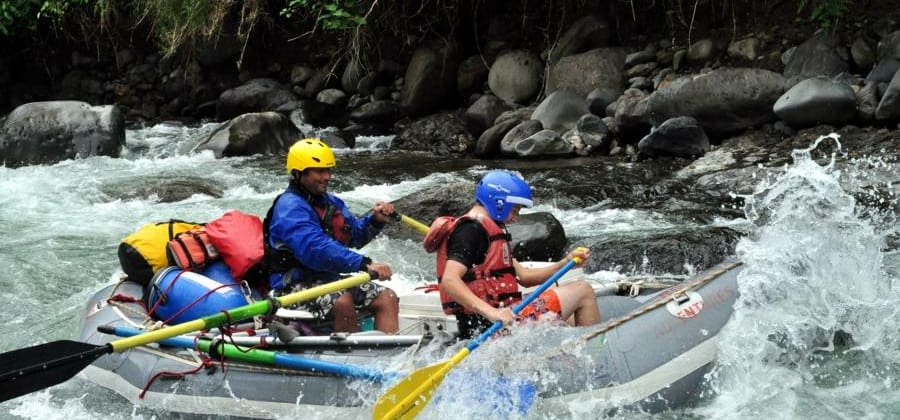 a disabled traveler whitewater rafting on the Pacuare River on an accessible vacation in Costa Rica