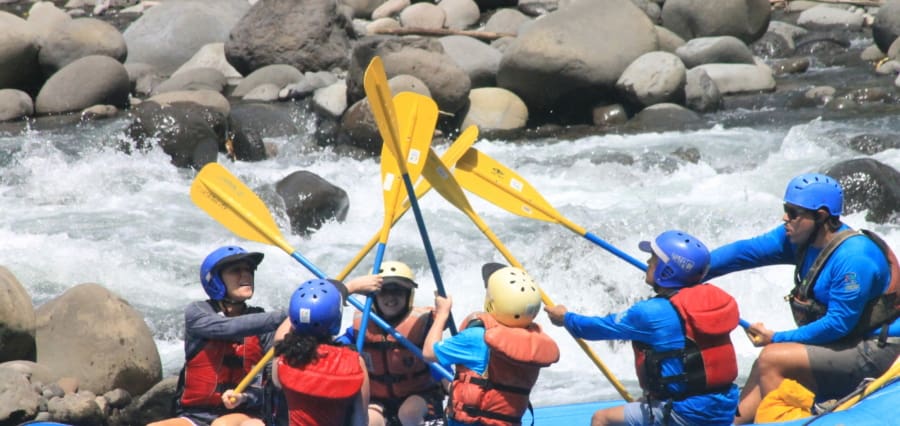 a family whitewater rafting on a multigeneration vacation in Costa Rica