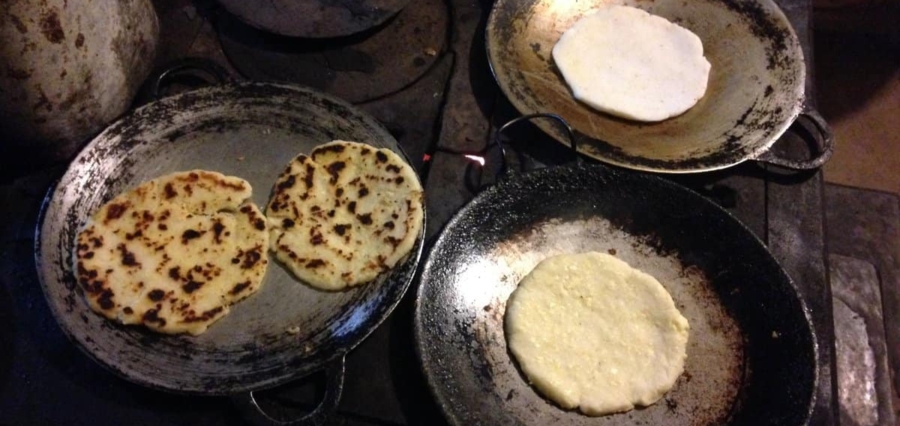 traditional handmade tortillas toasting during a cooking class on a custom vacation in Costa Rica