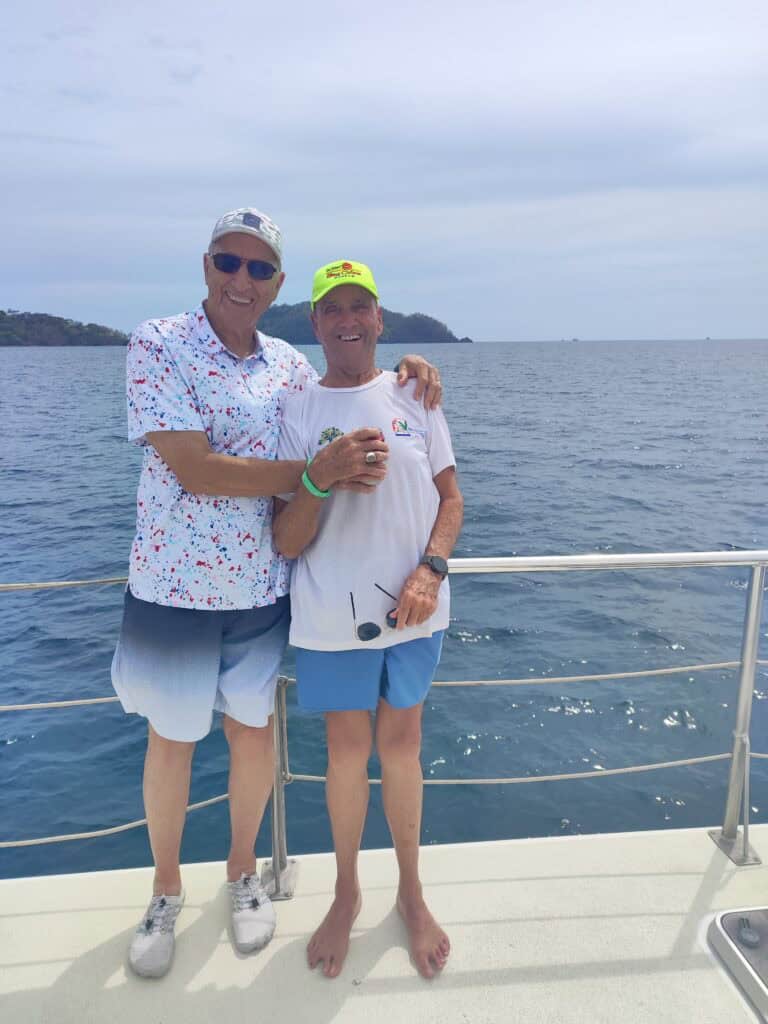 Two senior travelers on a catamaran tour in Costa Rica