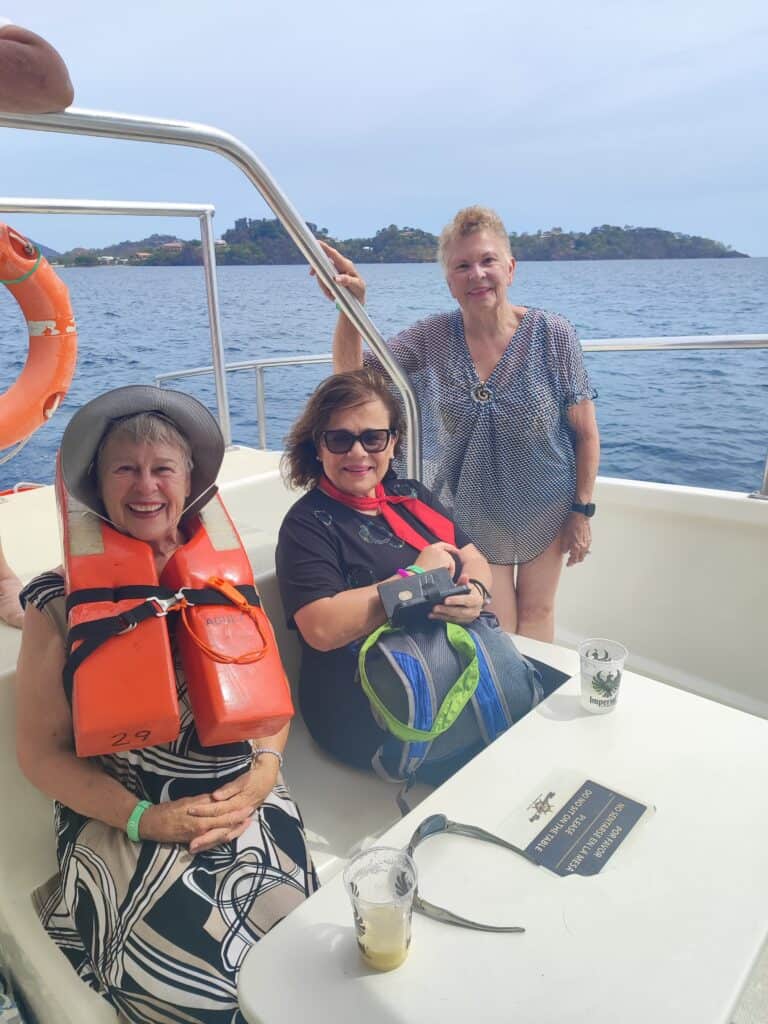 3 senior travelers on a catamaran tour in Costa Rica
