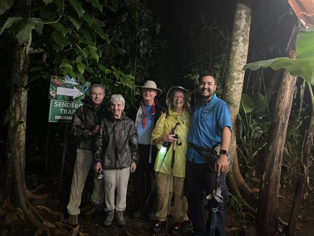 A group of senior travelers on a night walk at Arenal Oasis in Costa Rica