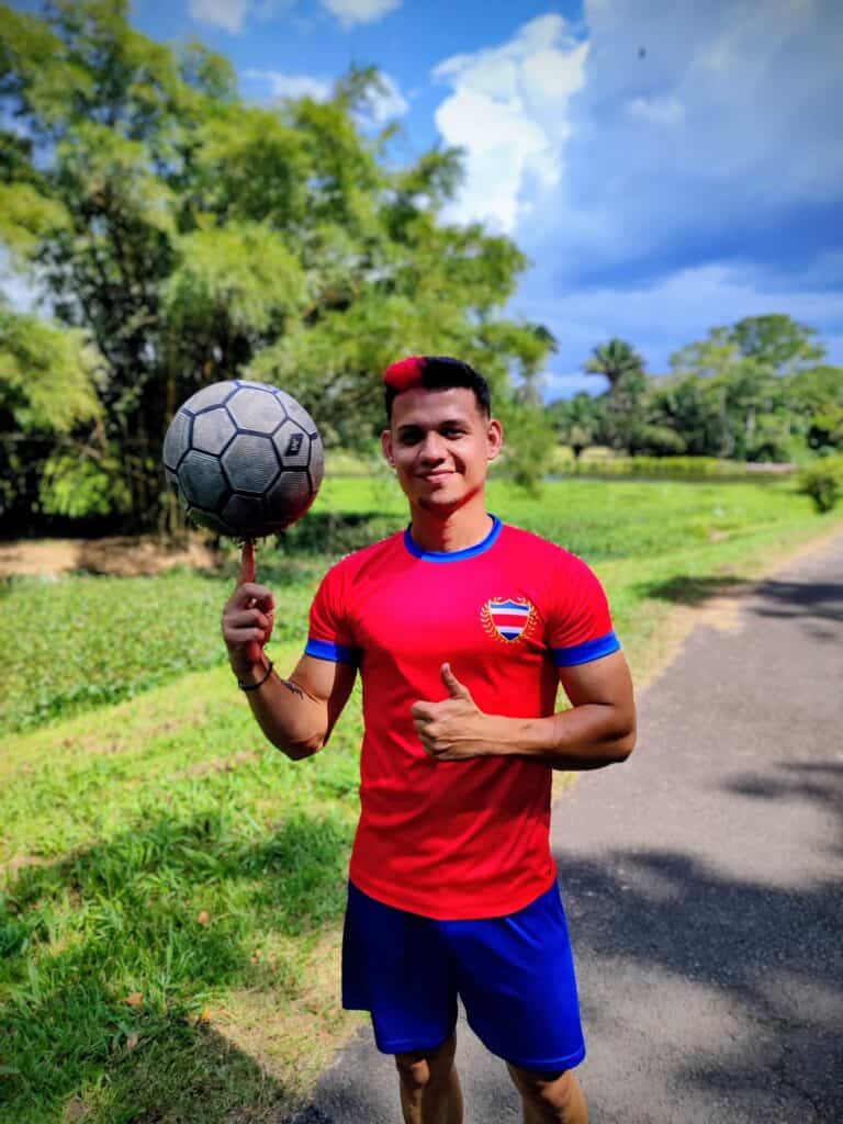 Dayronman Freestyle Footballer balancing a football on his index finger