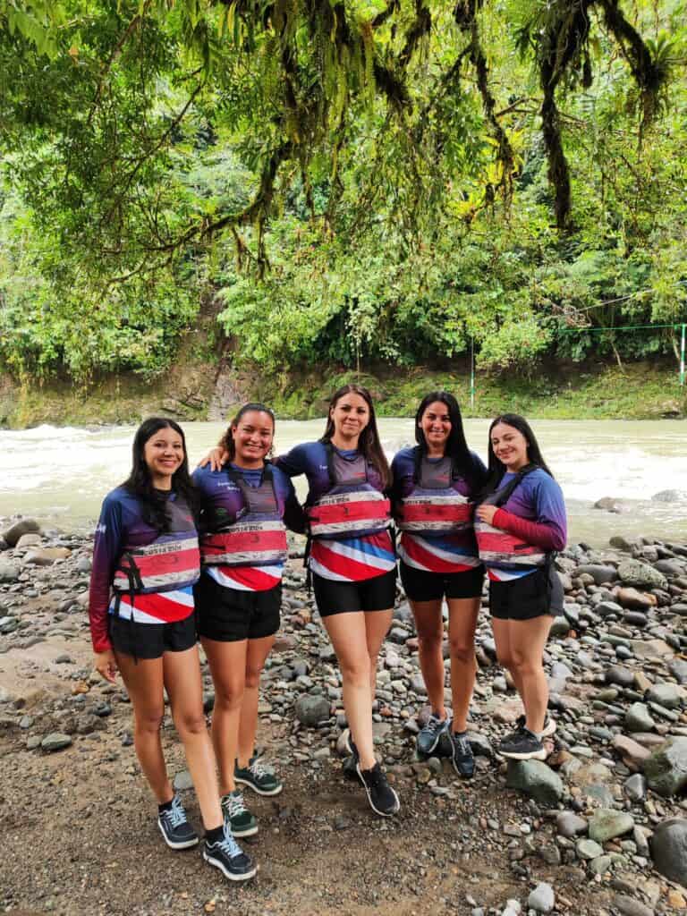 Chicas del Pacuare female rafting team on the banks of the Pejibaye river in Costa Rica