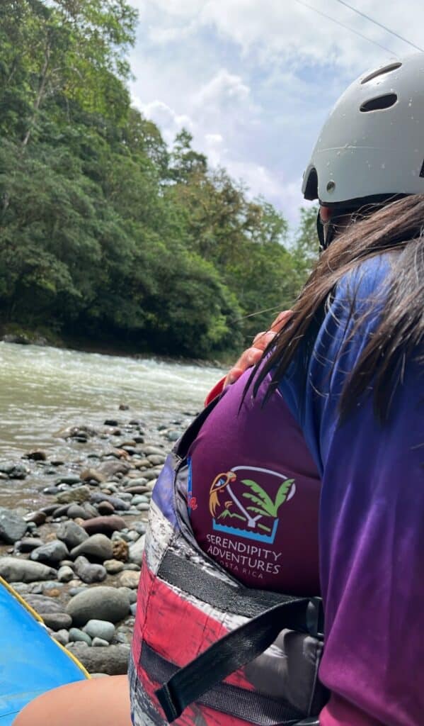Serendipity Adventures logo on the shirt of a Chicas del Pacuare rafting member