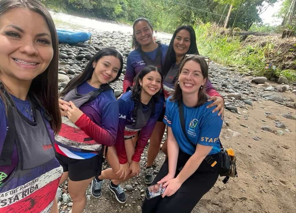 Chicas del Pacuare female rafting team on the banks of the Pejibaye river in Costa Rica with Helen from Serendipity Adventures